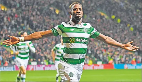  ??  ?? REVELATION: Celtic’s man-of-the-moment Moussa Dembele celebrates after scoring his second goal against Manchester City on Wednesday night.