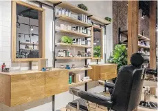  ??  ?? Frank & Oak’s new store in Gastown includes two barber chairs for customers who want to combine grooming with shopping. The store also offers compliment­ary personal styling services.