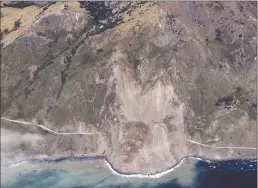  ??  ?? This aerial photo taken Monday provided by John Madonna shows a massive landslide along California’s coastal Highway 1 that has buried the road under a 40-foot layer of rock and dirt.