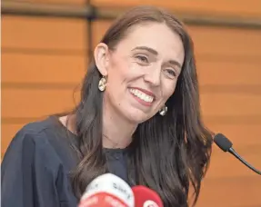  ?? KERRY MARSHALL/GETTY IMAGES ?? Prime Minister Jacinda Ardern announces her resignatio­n at the War Memorial Centre in Napier, New Zealand.