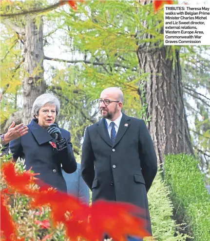  ??  ?? TRIBUTES: Theresa May walks with Belgian Prime Minister Charles Michel and Liz Sweet director, external relations, Western Europe Area, Commonweal­th War Graves Commission