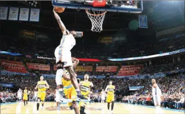  ?? AFP ?? Jerami Grant of the Oklahoma City Thunder goes up for a dunk during the game against the Denver Nuggets on Saturday at Chesapeake Energy Arena in Oklahoma City, Oklahoma.