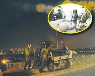  ?? (IDF) ?? DIVISION MEMBERS take part in a nighttime drill. Inset: Training the evacuation of wounded soldiers.