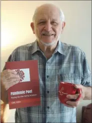  ?? COURTESY OF MARIS GROVE ?? Maris Grove resident Carl Koch holds his poetry book, “Pandemic Poet: Passing the time during lockdown.”