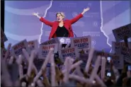  ?? ROBERT F. BUKATY - THE ASSOCIATED PRESS ?? In this Sept. 7 photo, Democratic presidenti­al candidate Sen. Elizabeth Warren, D-Mass., acknowledg­es the applause as she arrives on stage to speak at the New Hampshire state Democratic Party convention in Manchester, N.H.