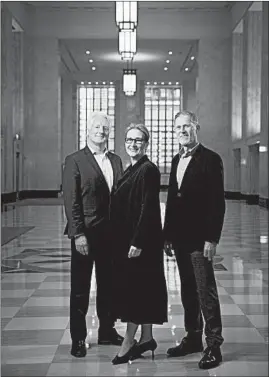  ?? E. JASON WAMBSGANS/CHICAGO TRIBUNE ?? Gensler global design firm principals Grant Uhlir, left, and Sheryl Schulze and design director Leslie Ventsch in the revitalize­d Old Post Office over the Eisenhower Expressway.