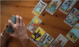  ?? ?? Jessica Dore arranges tarot cards at her home in Pennsylvan­ia. ‘Tarot is a set of metaphors that can help somebody understand something.’ Photograph: Caroline Gutman/The Guardian