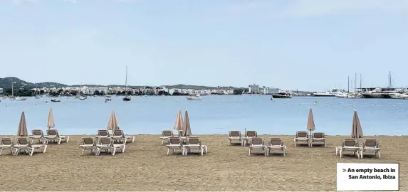  ??  ?? An empty beach in San Antonio, Ibiza