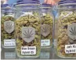  ?? TREVOR HUGHES, USA TODAY ?? Jars of dried marijuana flowers at the Denver-based Medicine Man marijuana store.
