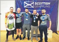  ??  ?? The Oban MMA team who took part in the UKBJJA West of Scotland Open at Ravenscrai­g. Left to right: Liam Roberts, Callum Weir, Gregory Black, Ruarigh Black and Russel MacLennan.