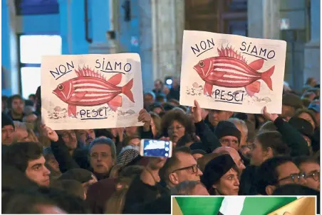  ??  ?? Effects of war: Demontrato­rs (above) holding placards reading ‘ We are not fish’ during a gathering by human rights associatio­ns in support of migrants, including minors, stranded aboard the rescue vessel ‘Sea Watch 3’ in Rome, while a child (right) suffering from malnutriti­on is measured at a hospital in Yemen.