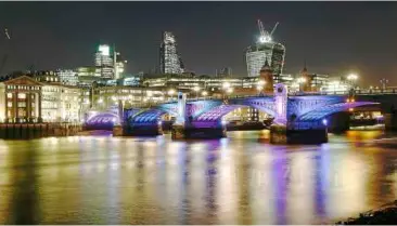  ??  ?? New skyline: The ancient city of London now boasts glittering glass towers and futuristic shapes. — reuters