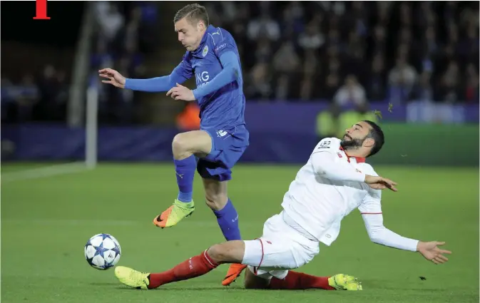  ??  ?? LEICESTER: Leicester’s Jamie Vardy, left, competes for the ball with Sevilla’s Adil Rami during the Champions League round of 16 second leg†soccer†match between Leicester City and Sevilla at the King Power Stadium in Leicester, England, yesterday. — AP