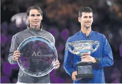  ?? AFP ?? Champion Novak Djokovic, right, and runner-up Rafael Nadal pose after the 2019 Australian Open final.