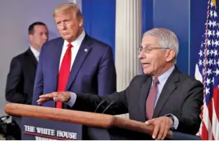  ?? AP PHOTO/ALEX BRANDON ?? President Donald Trump, left, listens in April as Dr. Anthony Fauci, director of the National Institute of Allergy and Infectious Diseases, speaks about the coronaviru­s in the James Brady Press Briefing Room of the White House in Washington.