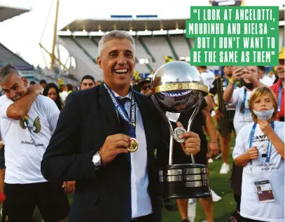  ??  ?? Below Crespo bags his first major gong as a manager – and what a trophy it is...