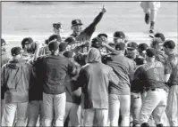  ?? The Associated Press ?? WILD WIN: The Colorado Rockies celebrate their 2-1 win in 13 innings early Wednesday against the Cubs in the National League wild-card playoff game in Chicago.