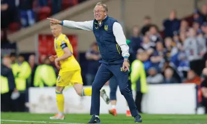  ?? ?? Ukraine manager Oleksandr Petrakov urges on his team during their 3-1 win over Scotland. Photograph: Tom Jenkins/The Guardian