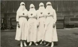  ??  ?? Red Cross nurses in 1918, Sydney, during the Spanish flu outbreak. Photograph: National Library of Australia