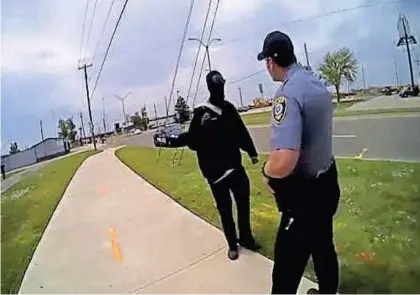  ?? PROVIDED BY THE OKLAHOMA CITY POLICE DEPARTMENT ?? An image from an Oklahoma City police officer's body-worn camera of an incident April 29 in south Oklahoma City that led to the arrest of the man dressed in black.