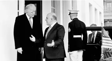  ??  ?? Trump greets al-Abadi at the White House in Washington, US. — Reuters photo