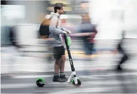  ?? Photo / NZME ?? Scootering, cycling or public transport can spare urban residents the expense of owning a car.