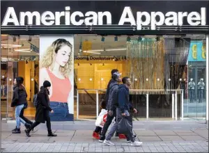  ?? Bloomberg News/CHRIS RATCLIFFE ?? American Apparel stores like this one in London are among business casualties in a quickly changing fashion industry.