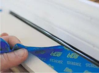  ?? STEVE MAXWELL ?? Masking tape applied to each side of a caulking joint is the best way to create crisp, neat results. Make sure to use 100 per cent silicone caulking when replacing broken glass in a window.