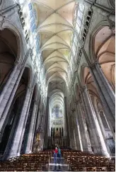  ??  ?? CLOCKWISE FROM LEFT Notre Dame cathedral took 68 years to build. An avenue of tall columns supports the arched ceilng. The exterior is adorned by 750 statues