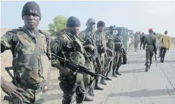  ?? REINNIER KAZE/AFP/GETTY IMAGES FILES ?? Soldiers from the Cameroon army are part of a regional force that includes counterpar­ts in Chad, Nigeria, Benin and Niger aiming to wipe out the extremist group Boko Haram.