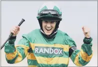  ?? PICTURES: TIM GOODE/PA WIRE. ?? RACING TRIUMPH: Rachael Blackmore celebrates with the trophy after becoming the first female jockey to win the world’s most demanding steeplecha­se the Randox Grand National Handicap Chase on Minella Times during Grand National Day.