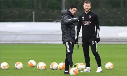  ??  ?? Mikel Arteta (left) has let Shkodran Mustafi end his Arsenal contract six months early and join the Bundesliga’s bottom club Schalke on a free transfer. Photograph: Stuart MacFarlane/Arsenal FC/Getty Images