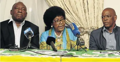  ??  ?? ANC stalwart Winnie Madikizela-Mandela is flanked by the party president Cyril Ramaphosa and secretary-general Ace Magashule at her home in Soweto.