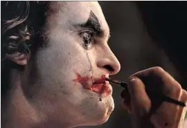  ?? Niko Tavernise Warner Bros. Pictures ?? JOAQUIN PHOENIX stars as Arthur Fleck in director Todd Phillips’ “Joker.” Festival organizers say it’s an “original vision” of the classic DC Comics villain.