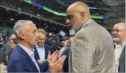  ?? RON BLUM — THE ASSOCIATED PRESS FILE ?? Baseball Commission­er Rob Manfred, left, and Major League Baseball Players Associatio­n executive director Tony Clark speak before Game 1 of the World Series in October.