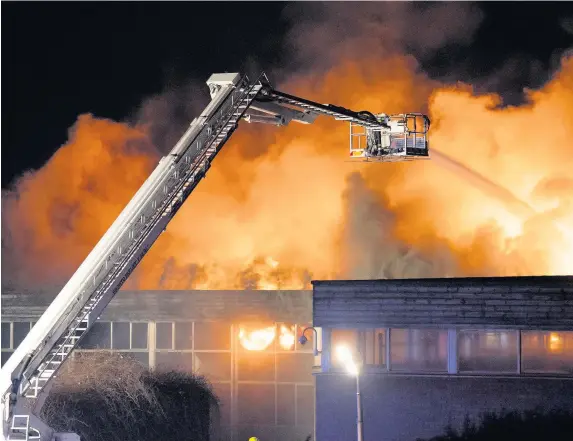  ?? Matthew Horwood ?? > Glyn Derw High School, Ely, Cardiff, was gutted in a blaze last year