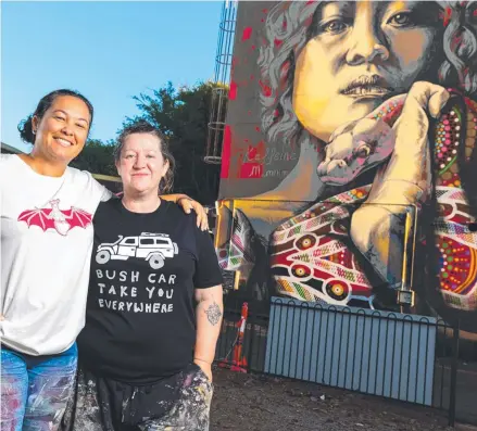  ?? ?? Artists Mim Cole and Kaff-eine in front of their mural in Nightcliff, a finalist in the Australia’s Street Art awards.