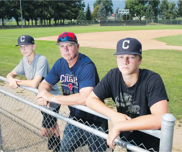 ?? GERRY KAHRMANN/PNG ?? Chilliwack Cougars pitcher Carter Harbut, left, and catcher Connor Dykstra flank coach Shawn Corness at the Fairfield Island baseball diamond. Harbut and Dykstra were suspended following an on-field brawl in July. Their coach thinks the penalties were too arbitrary.