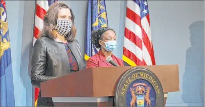  ?? The Associated Press ?? Michigan Gov. Gretchen Whitmer addresses the state Friday in Lansing, Mich. “We’re not in a political crisis where we should just negotiate and find some common ground here,” Whitmer said. Her stay-at-home order remains in effect through May 15.