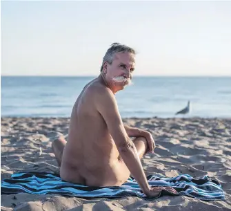  ??  ?? Stephane Deschenes, owner of Bare Oaks Family Naturist Park, at Hanlan’s Point beach on Toronto Island. Deschenes says clothed beachgoers can make some naturists uncomforta­ble.