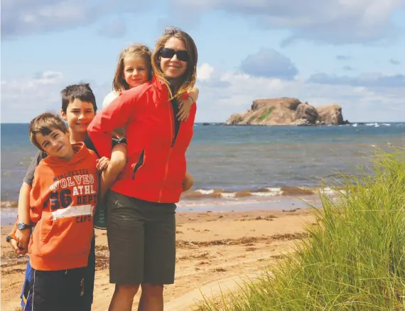  ?? MICHAEL PALMER ?? Ryan, Andrew, Jenna and Catharine Palmer on the Magdalen Islands, Que., during a journey that made the Palmer children “appreciate the world that was beyond Calgary.”