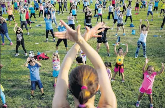  ?? Jay L. Clendenin Los Angeles Times ?? AT ALTA VISTA PARK, an instructor leads a class in 2015 as part of a local government effort to improve health in the community.