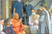  ?? ?? Chief minister Yogi Adityanath meeting families of traders.