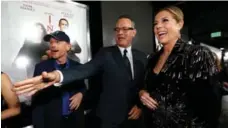  ?? MARIO ANZUONI/REUTERS ?? Tom Hanks, who plays Robert Langdon, attends a special screening of Inferno with his wife, Rita Wilson, and director of the movie Ron Howard.