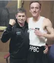  ??  ?? Peterborou­gh Police boxer Ryan Davies pictured with club coach Paul Goode.