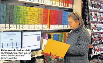  ??  ?? Rainbow of choice Nikki Livett can help people look up any of the thousands of tartans available