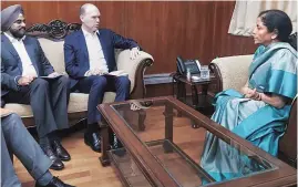  ?? PHOTO: PTI ?? FM Nirmala Sitharaman and Vodafone CEO Nick Read ( centre) during a meeting in New Delhi on Friday. Read is visiting India at a time when the telecom industry is facing a crisis