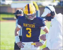  ?? OWEN MCCUE - MEDIANEWS GROUP ?? Pope John Paul II quarterbac­k Rocco DiRico, left, looks over the playsheet with PJP assistant coach Matt Bildstein on Saturday, Oct. 17.