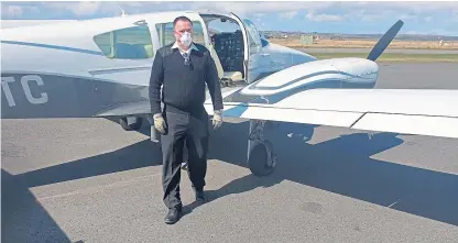  ?? Picture: Electrify. ?? Coupar Angus pilot Des Hart with his aircraft after flying-in Covid testing kits.