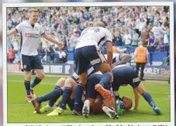  ??  ?? MR POPULAR: Aaron Wilbraham is mobbed by his team-mates